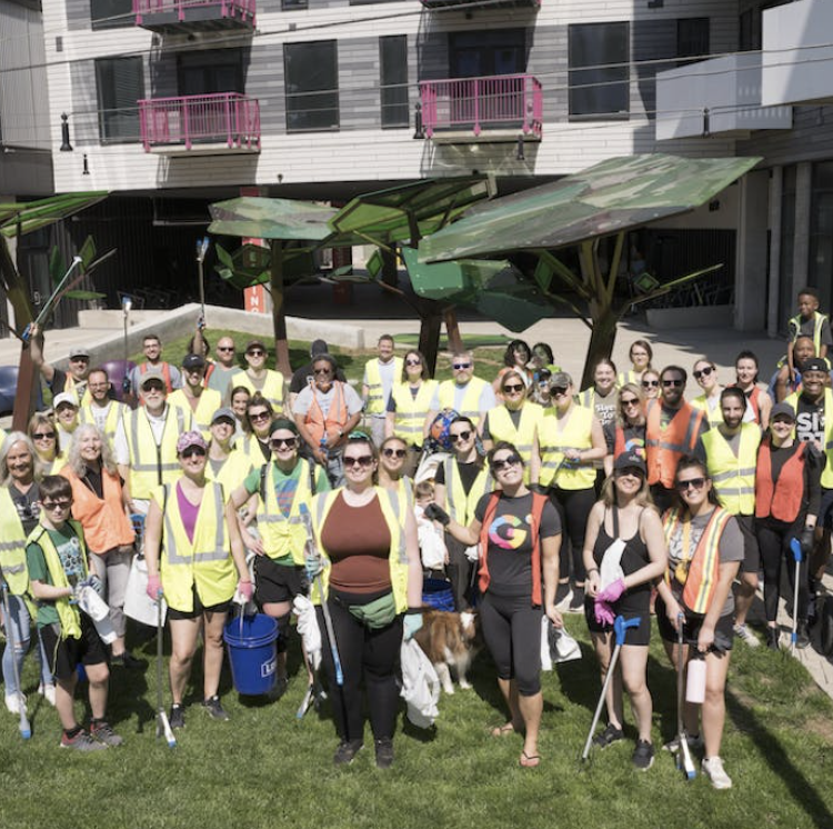 Volunteers in safety vests gathered for the annual Franklinton litter cleanup with Besa, Kaufman Development and the Franklinton Board of Trade